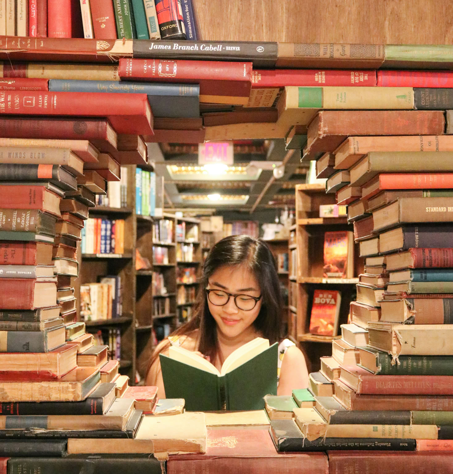 girl in circle of books