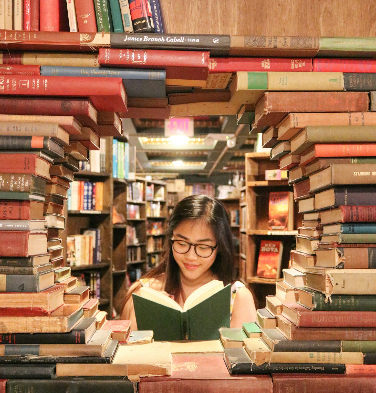 girl in circle of books