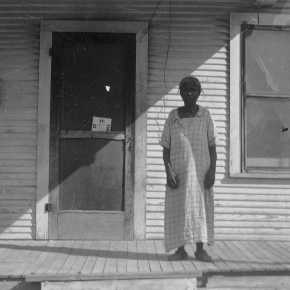 Picture of Jenny proctor, former slave, near her house.