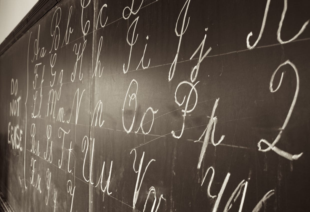 cursive writing on chalkboard