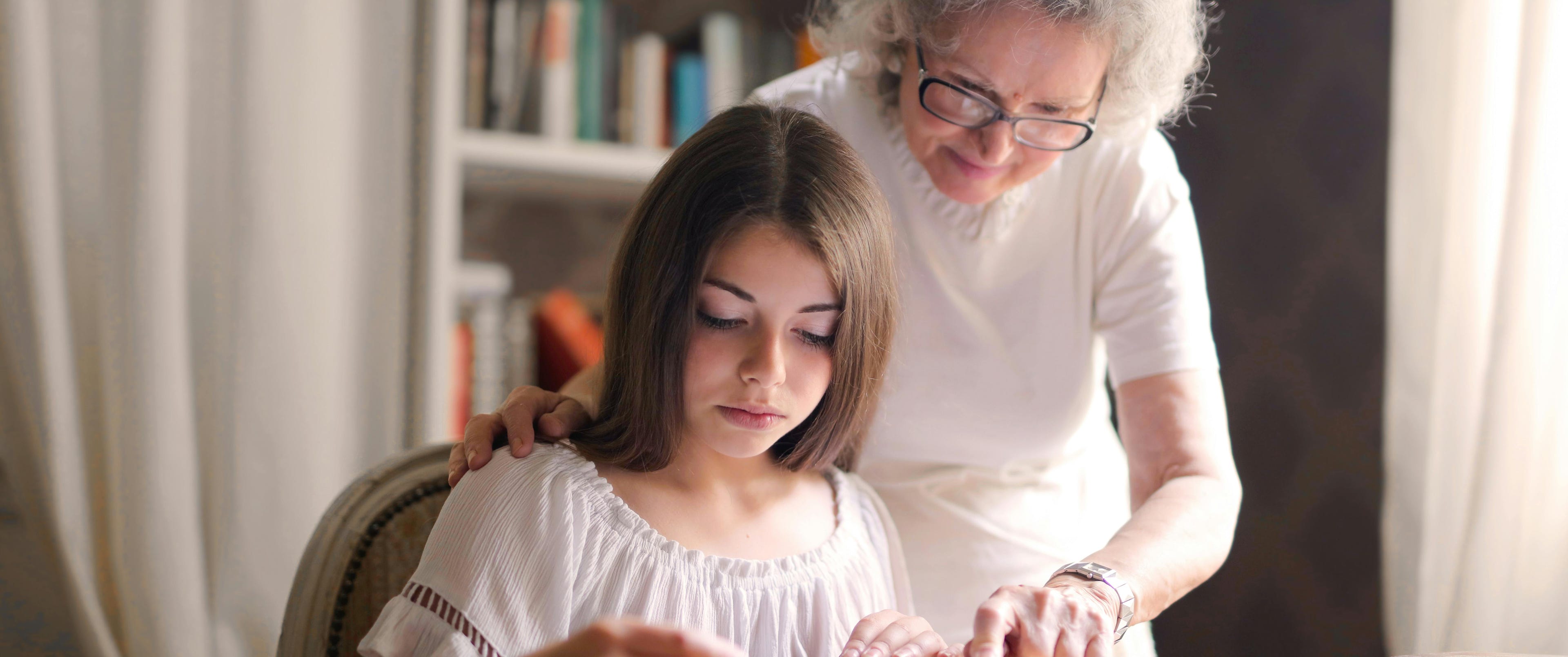 lady teaching girl